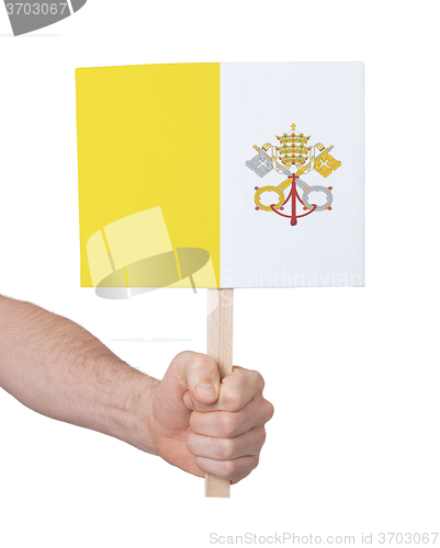 Image of Hand holding small card - Flag of Vatican City