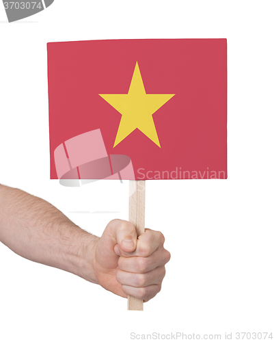 Image of Hand holding small card - Flag of Vietnam