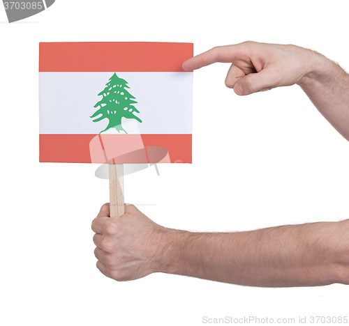 Image of Hand holding small card - Flag of Lebanon