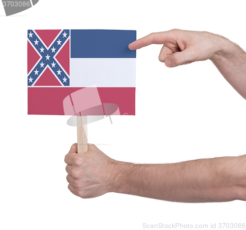 Image of Hand holding small card - Flag of Mississippi