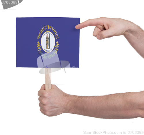 Image of Hand holding small card - Flag of Kentucky