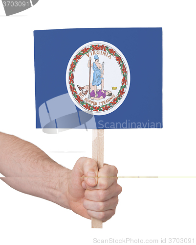 Image of Hand holding small card - Flag of Virginia