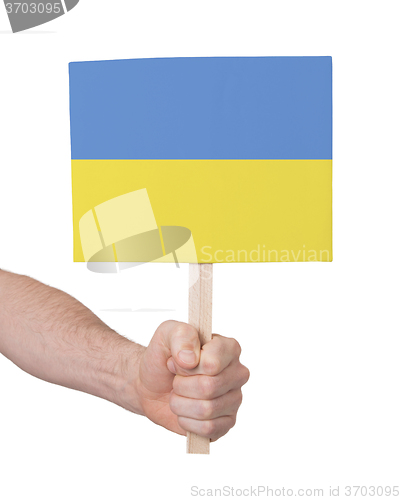 Image of Hand holding small card - Flag of Ukraine