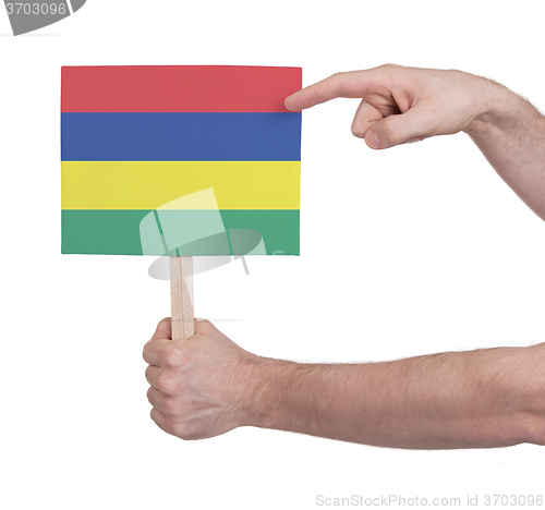 Image of Hand holding small card - Flag of Mauritius