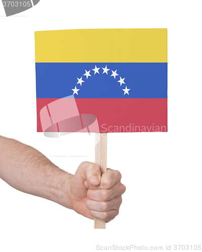 Image of Hand holding small card - Flag of Venezuela