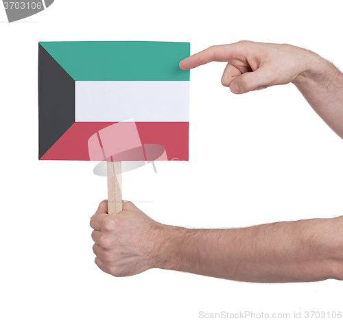 Image of Hand holding small card - Flag of Kuwait