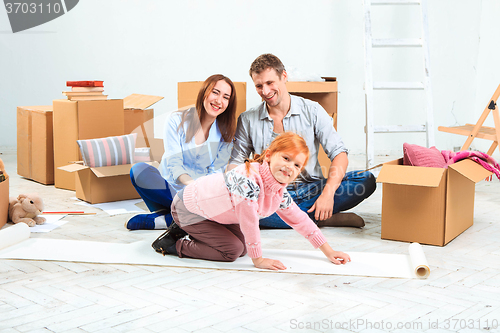 Image of The happy family  during repair and relocation