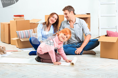 Image of The happy family  during repair and relocation