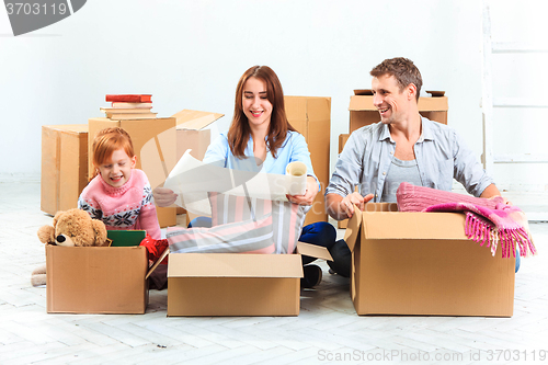 Image of The happy family  at repair and relocation