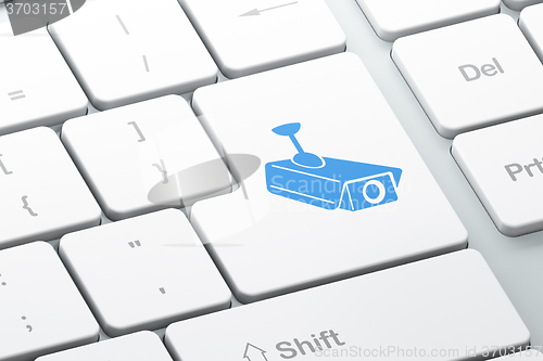 Image of Security concept: Cctv Camera on computer keyboard background