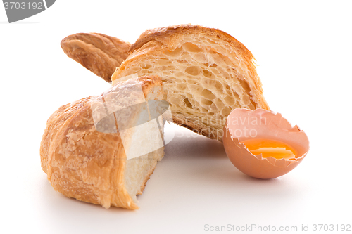 Image of Croissant and raw egg