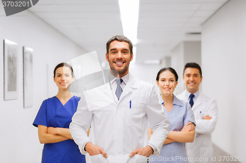 Image of happy group of medics or doctors at hospital