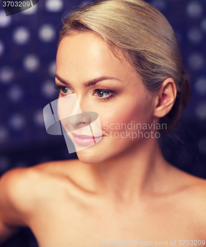 Image of close up of young woman sitting in bath towel