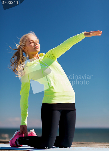 Image of woman doing sports outdoors