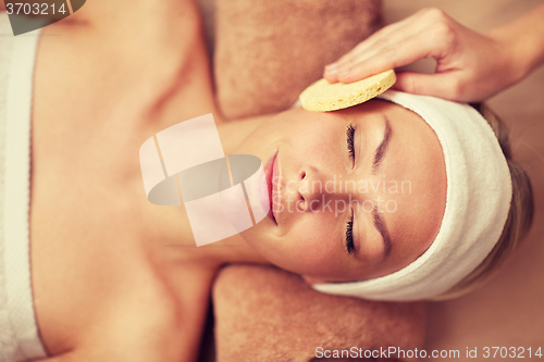 Image of close up of woman having face cleaning in spa