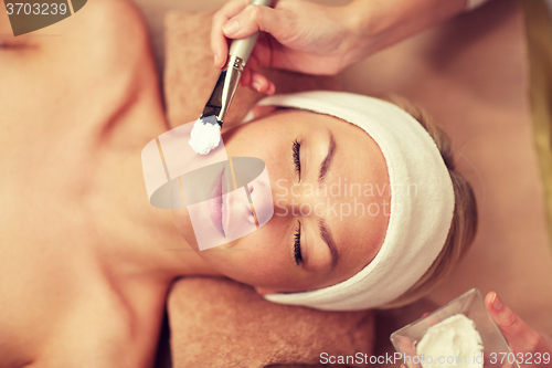 Image of close up of young woman and cosmetologist in spa