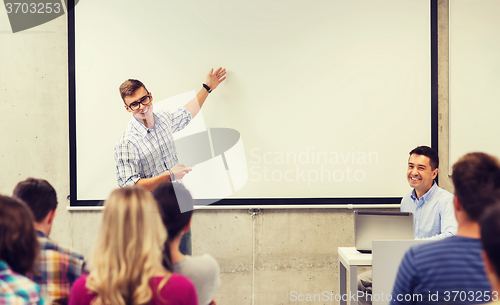 Image of group of students and teacher in classroom