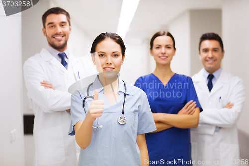Image of medics or doctors at hospital showing thumbs up