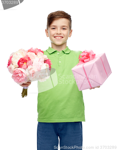 Image of happy boy holding flower bunch and gift box