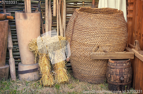 Image of Two beams and ancient objects of rural life.