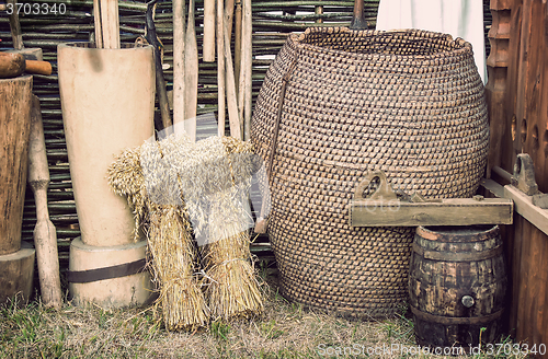 Image of Two beams and ancient objects of rural life.