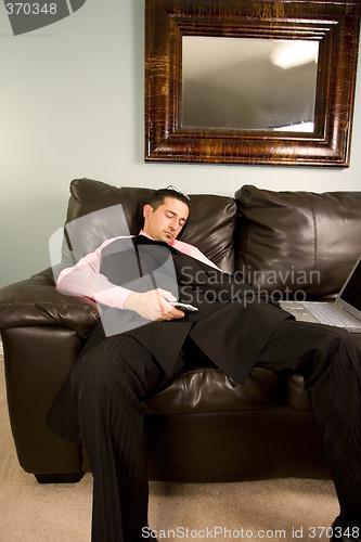 Image of Businessman Sleeping on the Couch