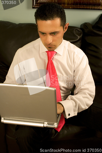 Image of Businessman Working on the Couch