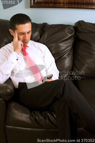 Image of Home or Office - Businessman Working on the Couch