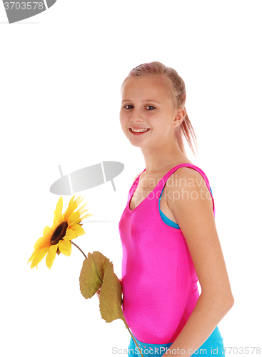 Image of Young girl standing in bathing suit. 