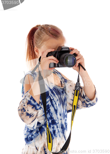 Image of Teenager girl staking pictures.