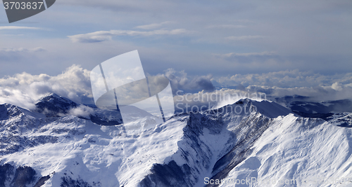 Image of Panoramic view on winter mountains in clouds