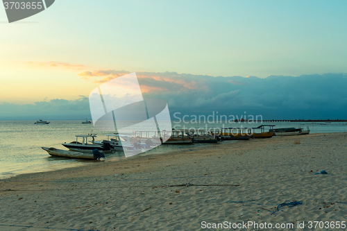 Image of Nusa penida, Bali beach with dramatic sky and sunset