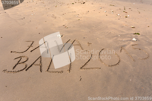 Image of Word Bali Java 2015 writing in sand
