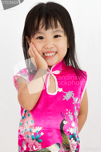 Image of Chinese Little Girl wearing Cheongsam with greeting gesture