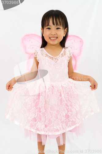 Image of Chinese little girl wearing butterfly custome