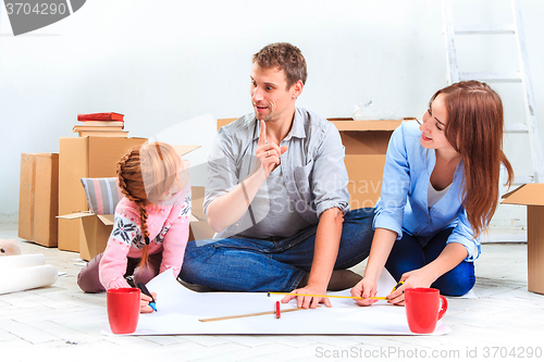 Image of The happy family  at repair and relocation