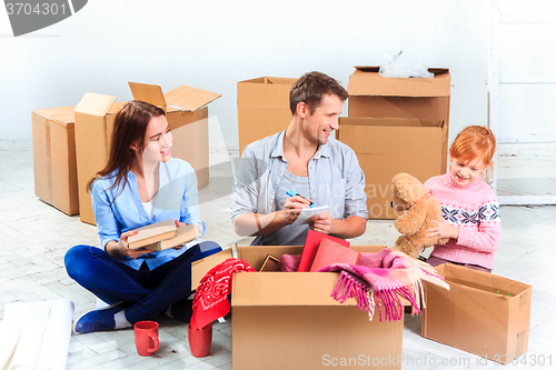 Image of The happy family  at repair and relocation