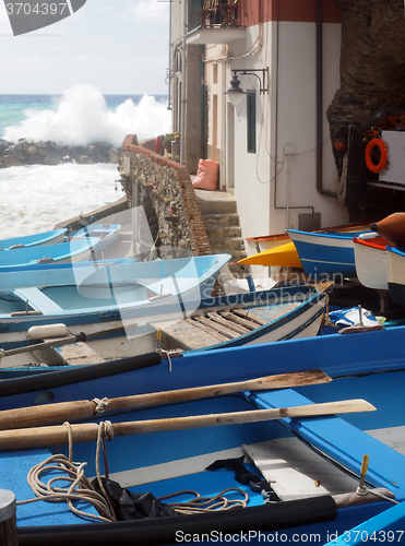 Image of   fishing row boats on land during rough sea Rio Marriore Cinque