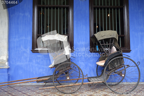 Image of Old rickshaw tricycle near Fatt Tze Mansion or Blue Mansion, Pen