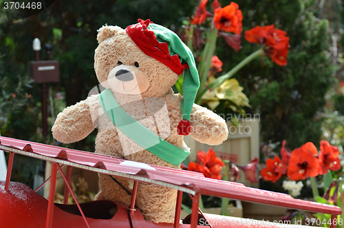 Image of Teddy bear in beautiful Christmas background