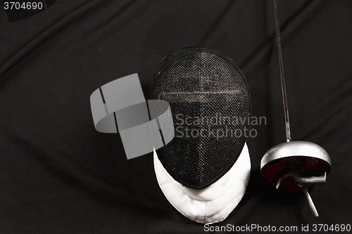 Image of The fencing mask and rapier 