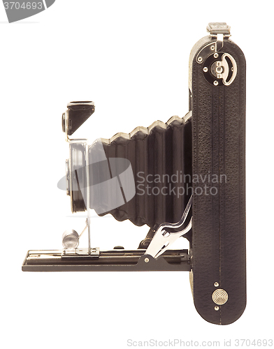 Image of Vintage folding bellows roll film camera in profile