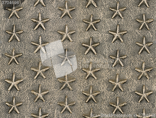 Image of Metallic star relief pattern texture