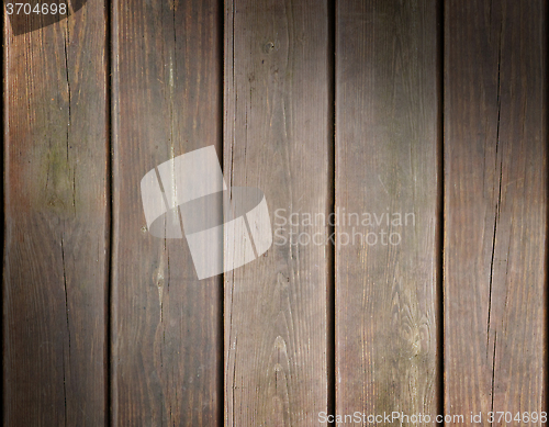 Image of Weathered wooden plank background lit diagonally