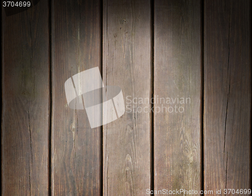 Image of Weathered wooden plank background lit from above