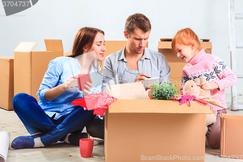 Image of The happy family  during repair and relocation