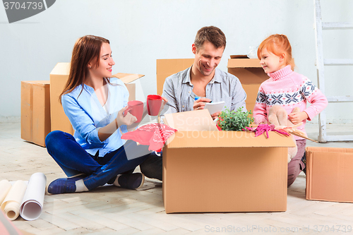 Image of The happy family  during repair and relocation