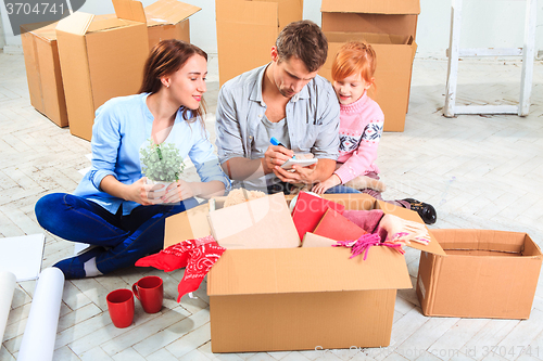 Image of The happy family  during repair and relocation