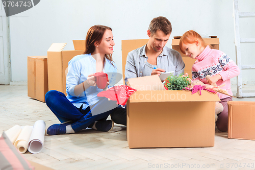 Image of The happy family  during repair and relocation