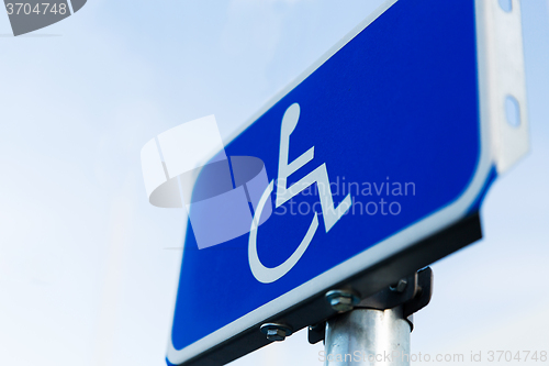 Image of close up of road sign for disabled outdoors